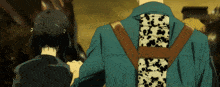 a man in a blue jacket with a cow print on his back