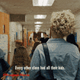 a woman is walking down a hallway with a caption that says every other class had all their kids