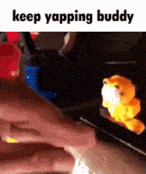 a person is holding a stuffed animal with the words keep yapping buddy above it