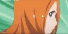 a close up of a girl 's face with a play button in the corner .
