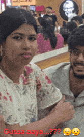 a man and a woman are posing for a picture with the words gussa aaya