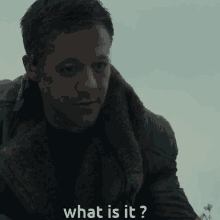 a man is asking what is it in a dark room