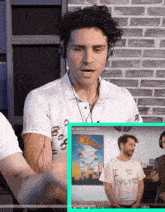 a man wearing headphones looks at a screen that says we were robbed