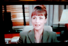 a close up of a woman 's face on a screen