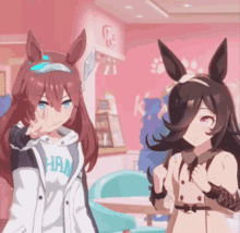 two anime girls are standing next to each other with one wearing a jacket that says han