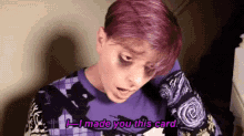 a person with purple hair is wearing a purple sweater and talking to someone .