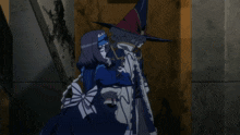 a couple of anime characters standing next to each other with one wearing a witch hat