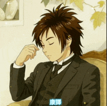 a man in a tuxedo is sitting on a couch