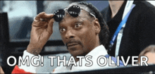 snoop dogg wearing sunglasses with the words " omg thats oliver " below him