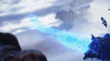 a person is flying through the air with a blue light coming out of their hand