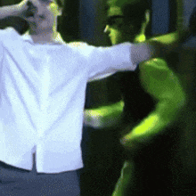 a blurry picture of a man in a white shirt