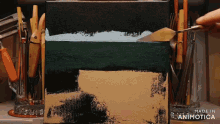 a painting is being painted with a spatula and the words made in animotica are visible