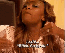a woman is saying " bitch fuck you "
