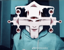 a person with a cross on their face and the name miamicookie below it