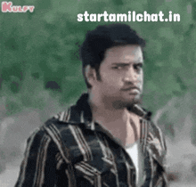 a man in a striped shirt is looking at the camera with the words starttamilchat.in written below him