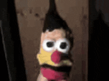 a close up of a stuffed animal with a mr potato head on it .
