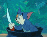 tom from tom and jerry is holding a knife in a pot