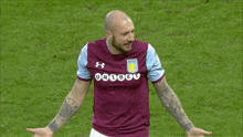 a soccer player wearing a shirt that says avfc on the front