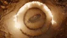 an aerial view of a circle of fire on the ground