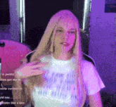 a woman with long blonde hair is wearing a white t-shirt that says " i saw the light " on it