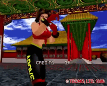 a video game screen shows a woman in boxing gloves and the words credits 3 on the bottom