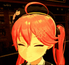a close up of a girl with red hair wearing a hat with a cat on it
