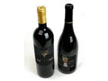 two bottles of wine one of which has a picture of a cat on it