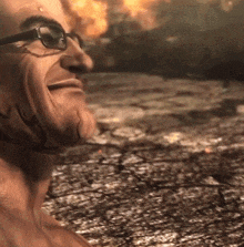 a close up of a man 's face with glasses and a cracked ground in the background