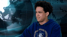 a young man wearing a blue hoodie that says ' dtown school of science and technology '