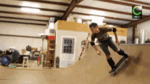 a skateboarder is doing a trick on a ramp with a green c on the bottom