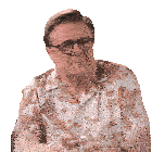 a man wearing glasses and a hawaiian shirt is holding a glass of wine