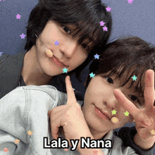 a couple of boys giving a peace sign with lala y nana written on the bottom