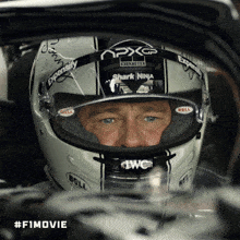 a man wearing a helmet that says shark ninja on the front