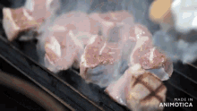 a bunch of meat is being cooked on a grill .