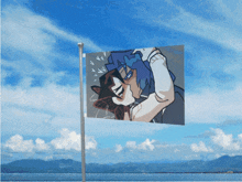 a flag with a picture of a man and woman kissing against a blue sky