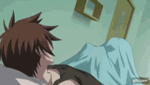 a man is laying in a bed with a blue blanket and a shelf in the background .