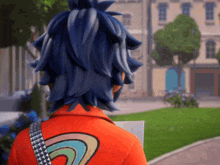 a person with blue hair is wearing an orange jacket with a rainbow design on the back