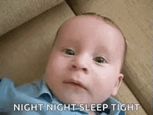 a baby is laying on a couch with the words `` night night sleep tight '' written on it .