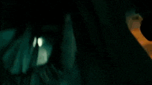 a group of soldiers are fighting in a dark room in a movie .