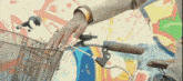 a woman 's hand reaches into a bicycle basket in front of a graffiti wall