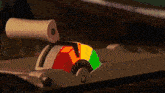 a colorful item with a white handle and a green yellow and red circle on it
