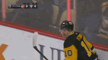 a hockey player with the number 10 on his jersey is celebrating