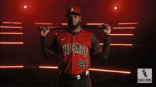 a man is wearing a red chicago jersey with the number 1 on it