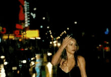 a blurry picture of a woman standing in front of a sign that says 20