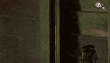 a man without a shirt is standing in a doorway .