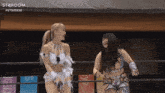 two women in a wrestling ring with the word stardom on the top