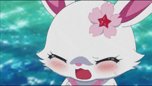 a cartoon rabbit with a pink flower on its head