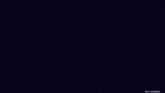 a purple light is coming from a black hole