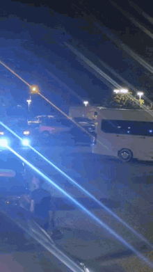 a police officer is standing in front of a busy parking lot