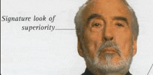 a man with a beard and a signature look of superiority is shown .